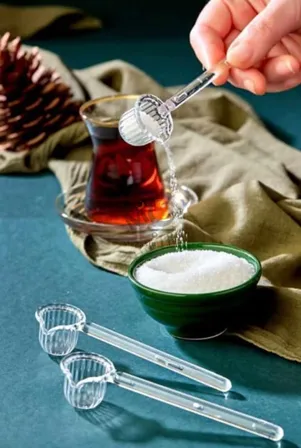 Cuillère doseuse en plastique